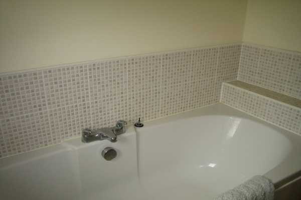 This shows the bath and tiling we completed.